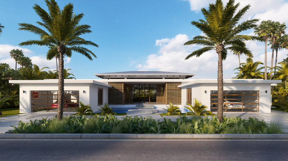 Inspiration for a mid-sized tropical white one-story stucco house exterior remodel in Miami with a hip roof and a metal roof