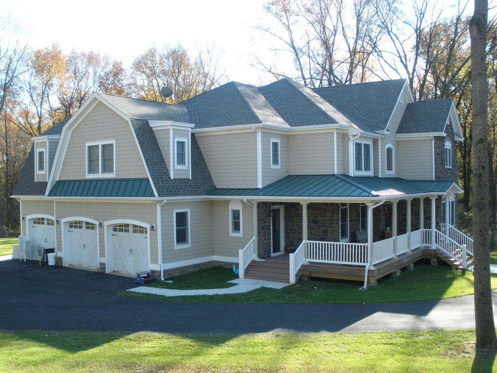 This is an example of a farmhouse two floor house exterior in New York with vinyl cladding.