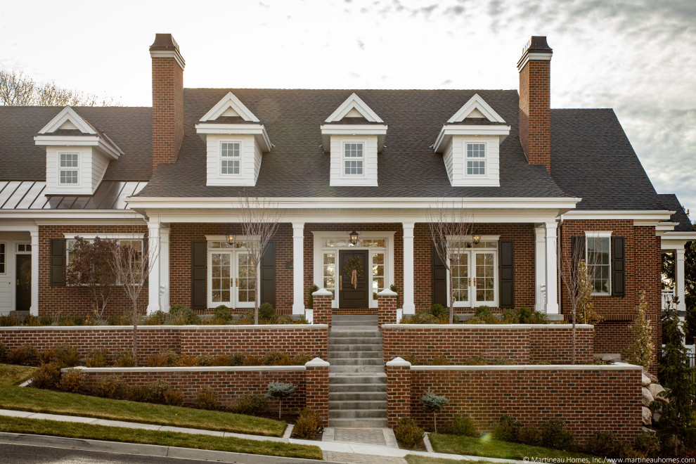 Design ideas for a large and red classic two floor brick detached house in Salt Lake City with a shingle roof.