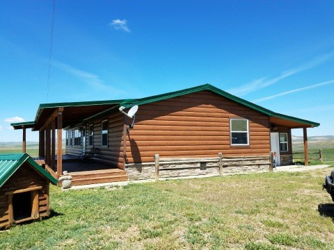 This is an example of a rustic detached house in Denver with metal cladding.