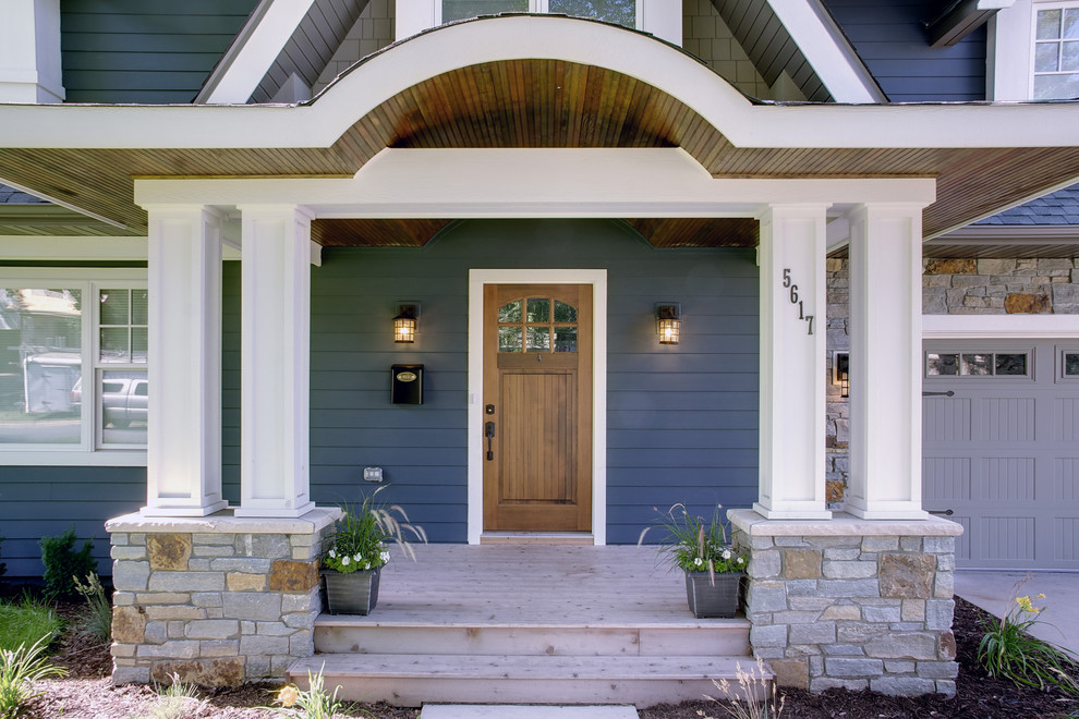 This is an example of a classic house exterior in Minneapolis with wood cladding.