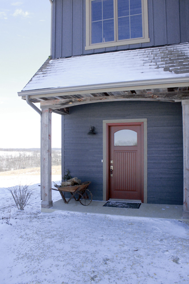 Inspiration for a medium sized and blue rustic two floor house exterior in Other with mixed cladding.