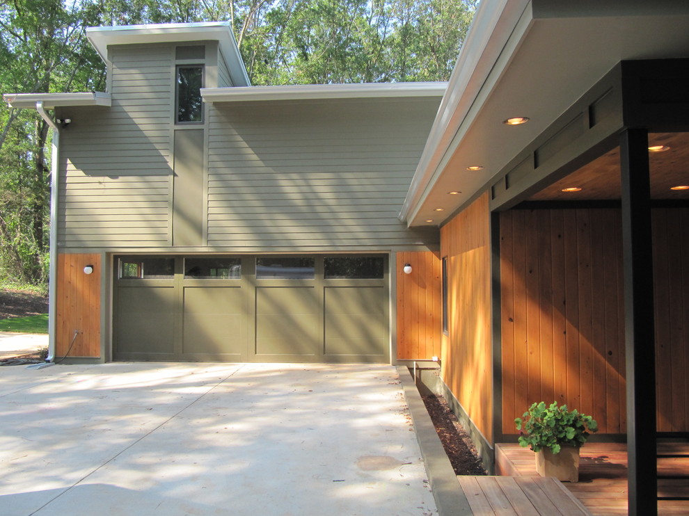Contemporary green two-story wood exterior home idea in Atlanta