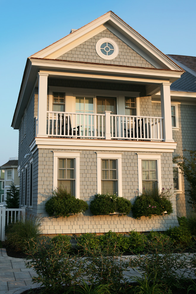 Design ideas for a medium sized nautical two floor house exterior in Philadelphia with wood cladding.