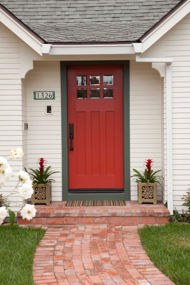 Small traditional white one-story wood exterior home idea in San Diego with a shingle roof