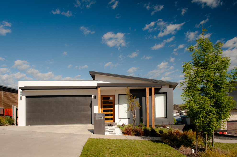 Trendy white one-story exterior home photo in Canberra - Queanbeyan