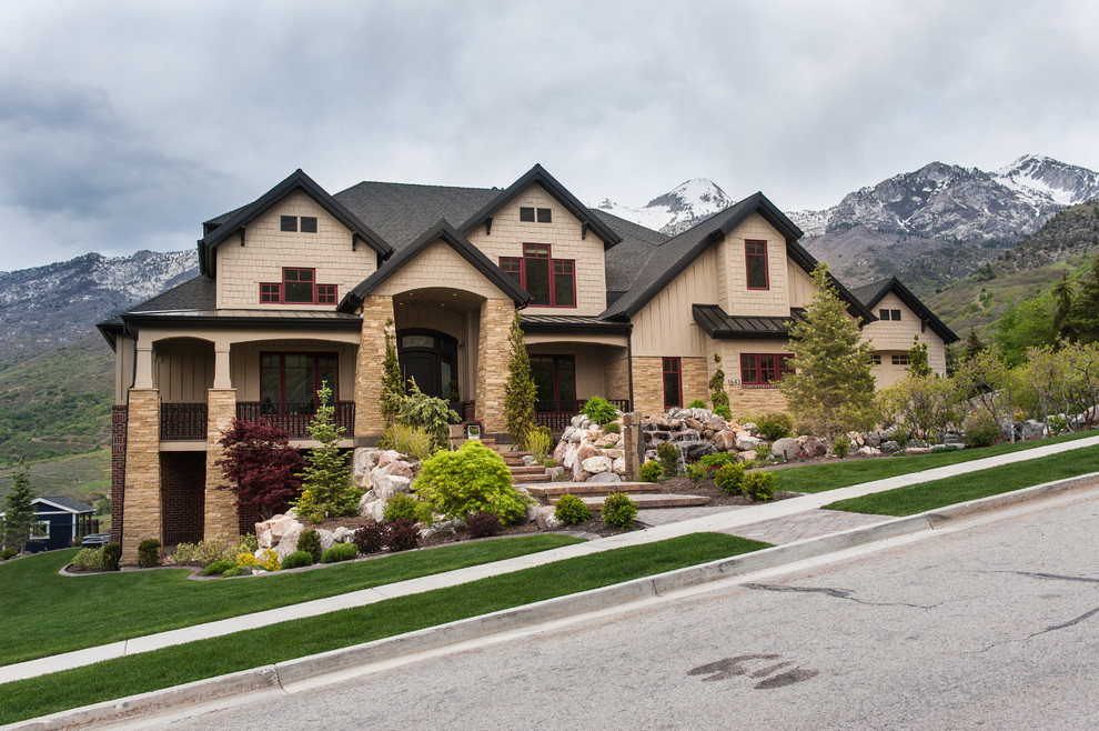 Example of an arts and crafts beige two-story mixed siding exterior home design in Salt Lake City