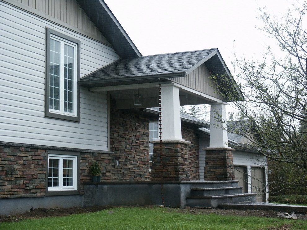 Example of a classic exterior home design in Ottawa