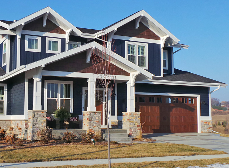 Example of an arts and crafts blue exterior home design in Other