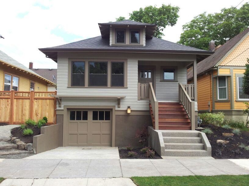 Inspiration for a small craftsman brown two-story concrete fiberboard exterior home remodel in Portland with a hip roof