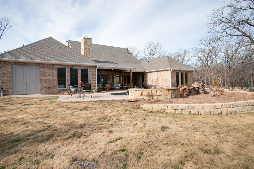 Example of a large farmhouse beige one-story mixed siding gable roof design in Dallas