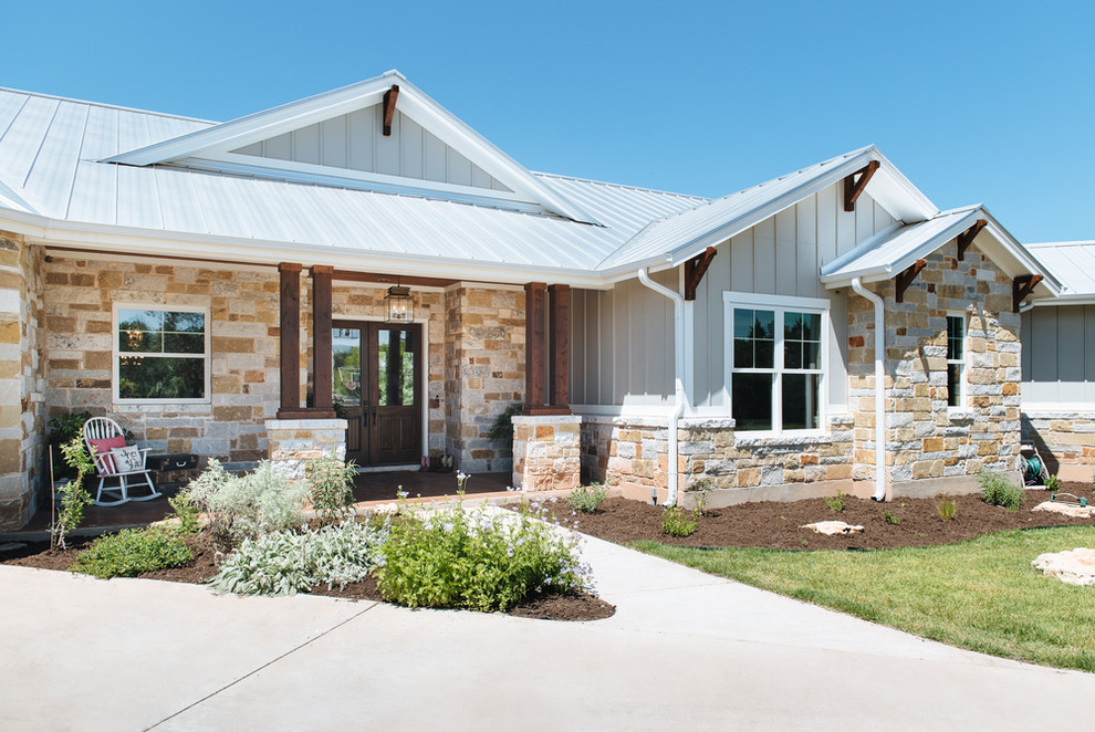 Inspiration for a craftsman gray one-story stone exterior home remodel in Austin