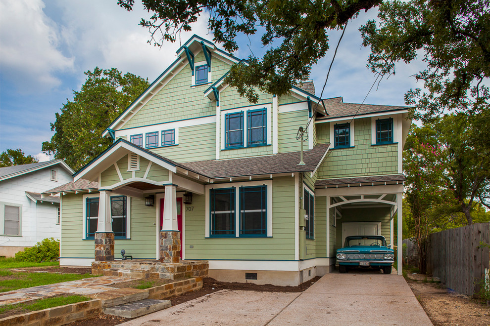 Green traditional two floor glass detached house in Austin with a pitched roof and a shingle roof.