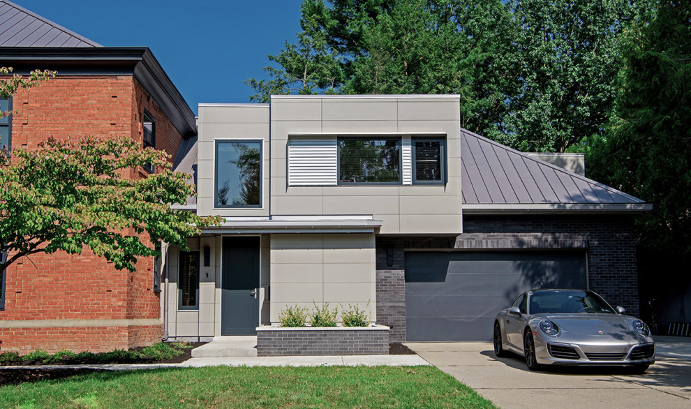 Mittelgroßes, Zweistöckiges Modernes Einfamilienhaus mit Faserzement-Fassade, grauer Fassadenfarbe und Flachdach in Sonstige