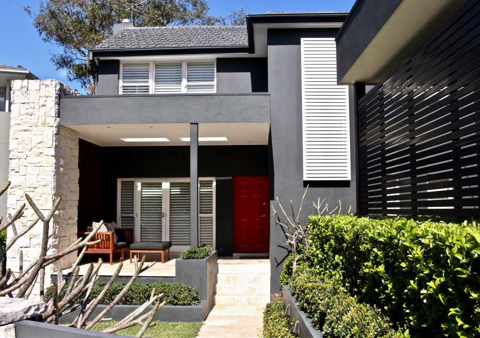 Modernes Einfamilienhaus mit Backsteinfassade, Flachdach und Blechdach in Sydney