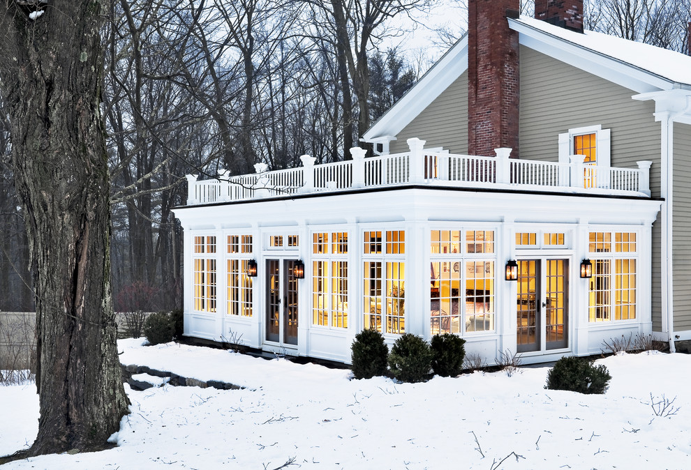 This is an example of a classic two floor house exterior in New York with wood cladding.