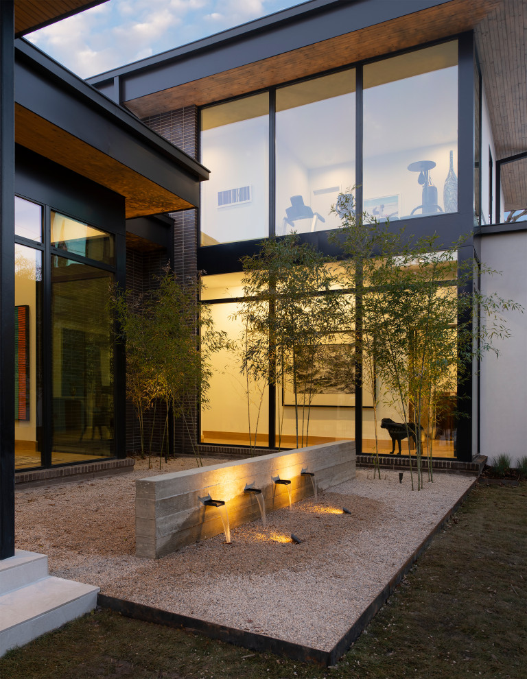 Foto de fachada de casa multicolor minimalista grande de dos plantas con revestimiento de ladrillo y tejado plano
