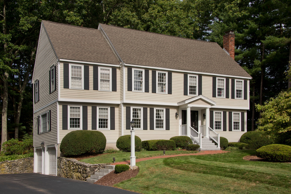 Mid-sized traditional beige two-story vinyl gable roof idea in Boston