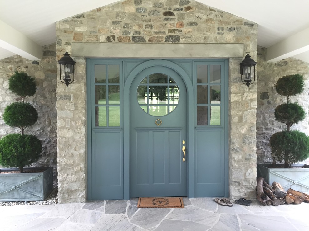 Example of a mid-sized classic gray two-story stone gable roof design in Phoenix