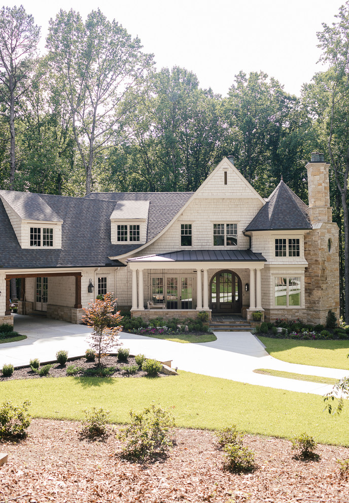 Large transitional beige two-story wood house exterior photo in Atlanta with a hip roof and a shingle roof