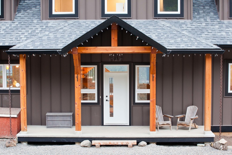 Inspiration for a mid-sized timeless brown two-story metal gable roof remodel in Vancouver