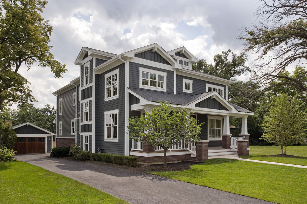 Design ideas for a large and blue classic two floor detached house in Chicago with wood cladding, a pitched roof, a shingle roof, a black roof and shiplap cladding.