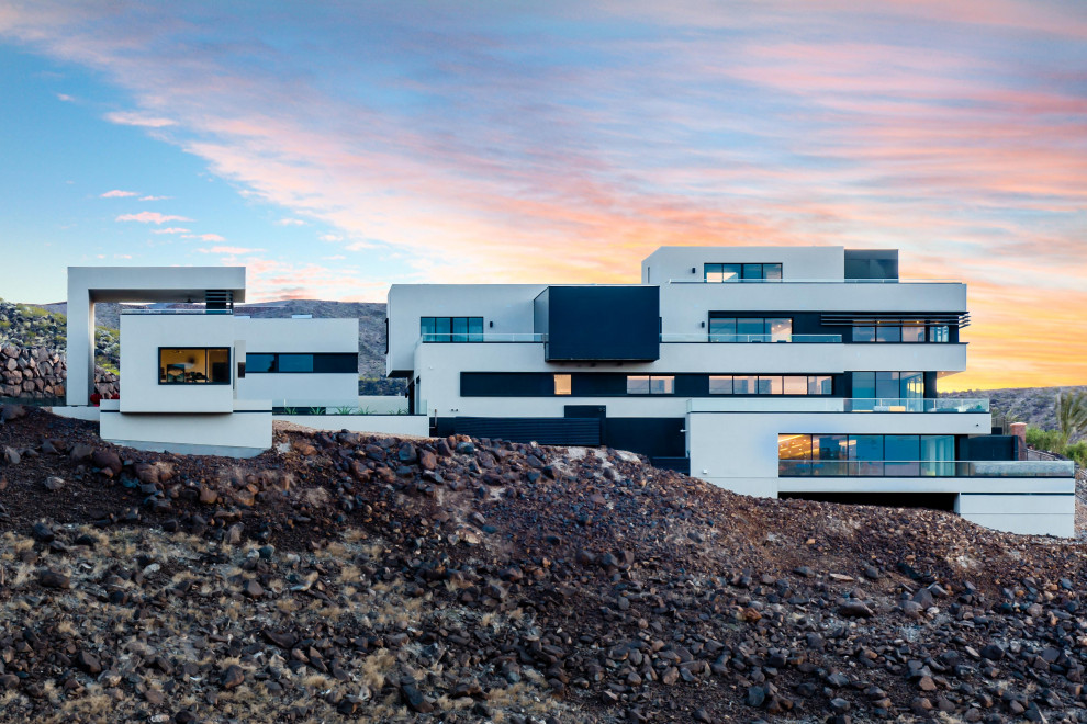 Photo of an expansive contemporary detached house in Las Vegas with four floors and a flat roof.