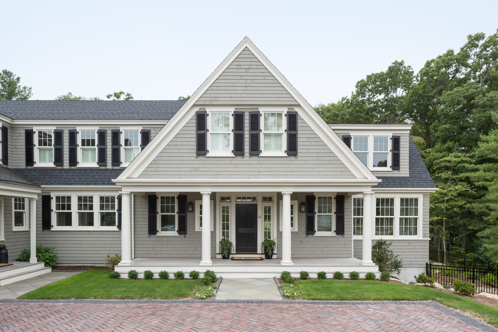 Inspiration for a large timeless gray two-story wood gable roof remodel in Boston