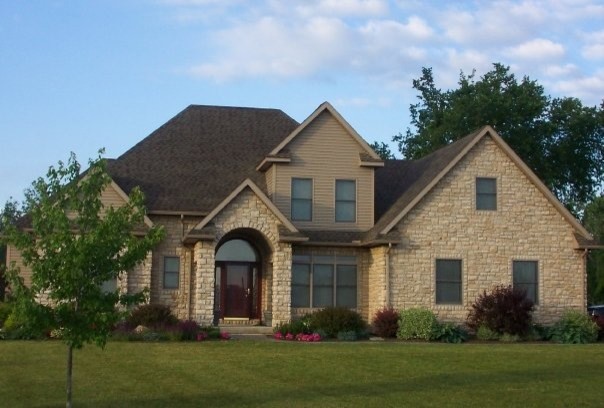 Large transitional beige three-story stucco gable roof photo in Columbus