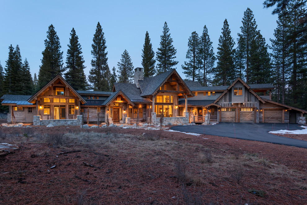 Mountain style brown two-story wood exterior home photo in Other with a shingle roof