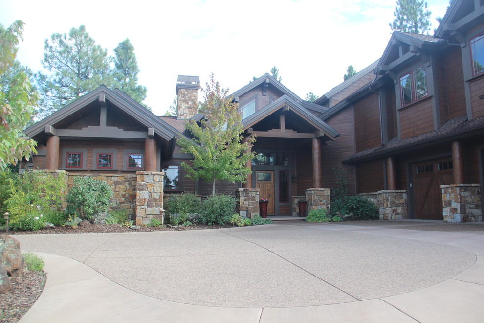 Example of a large arts and crafts brown two-story wood exterior home design in Phoenix