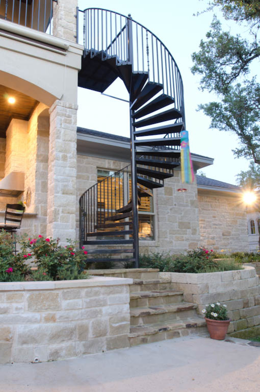 Inspiration for an expansive and white classic two floor house exterior in Austin with stone cladding.