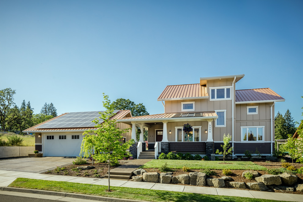 Foto della villa marrone american style a due piani di medie dimensioni con rivestimento con lastre in cemento, tetto a capanna e copertura in metallo o lamiera