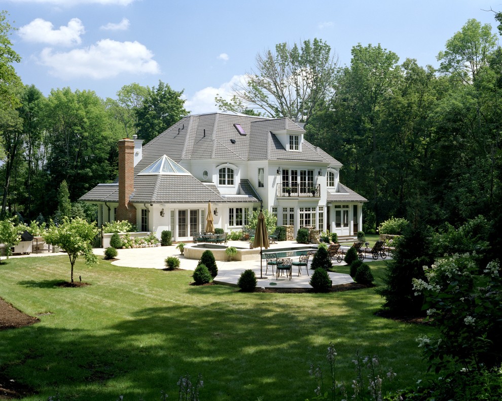 Design ideas for a white classic two floor house exterior in Boston with a hip roof.