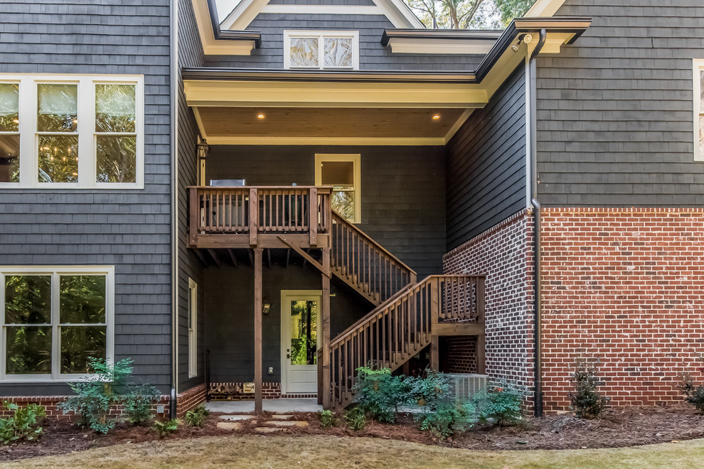 Large transitional blue two-story mixed siding gable roof idea in Atlanta