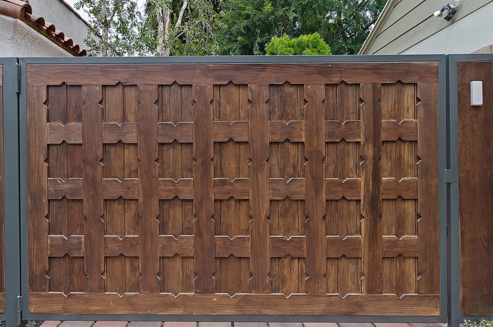 Custom wood driveway gate Mediterranean Exterior Los Angeles by
