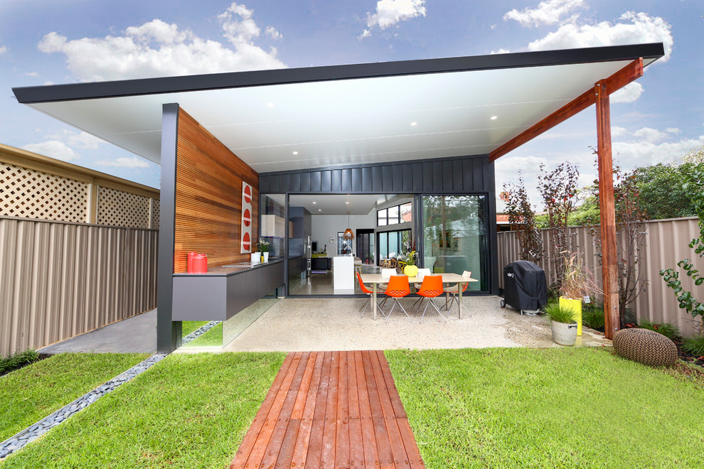 Design ideas for a medium sized and black scandinavian bungalow house exterior in Adelaide with metal cladding.
