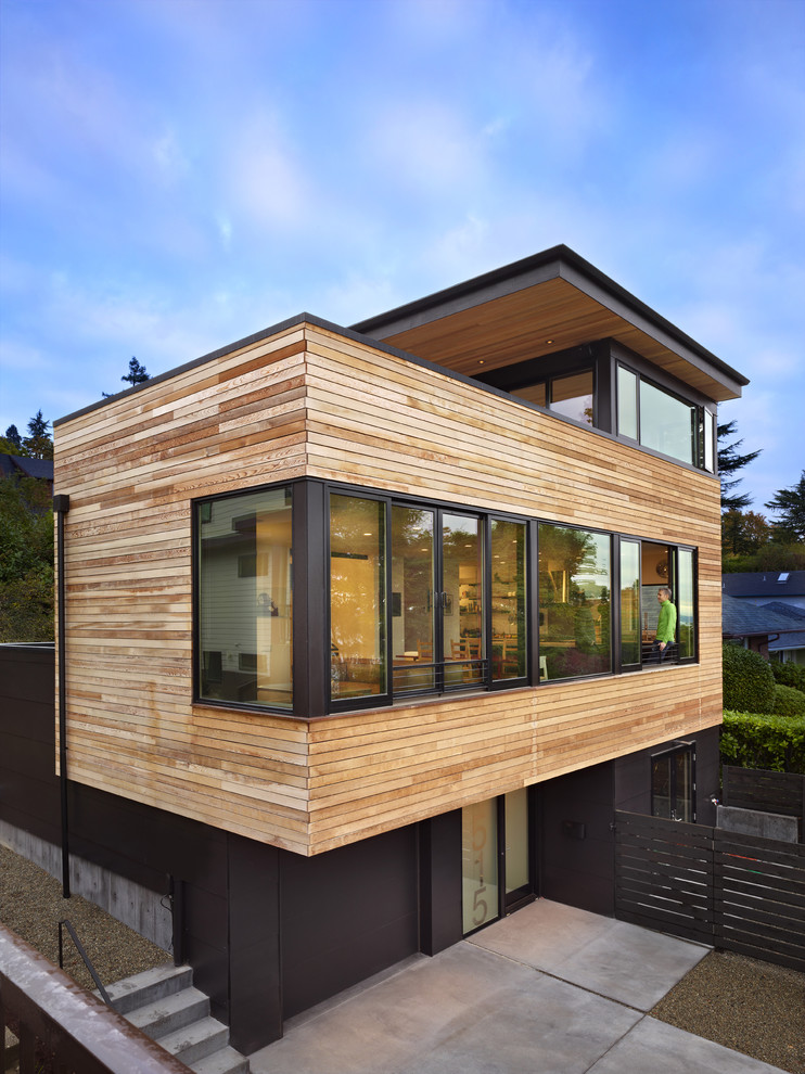 Idéer för mellanstora funkis svarta hus, med tre eller fler plan, blandad fasad och platt tak