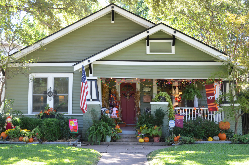 Example of an arts and crafts green exterior home design in Dallas
