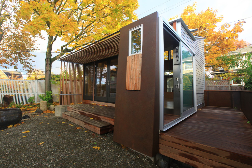 This is an example of a contemporary house exterior in Seattle with wood cladding.