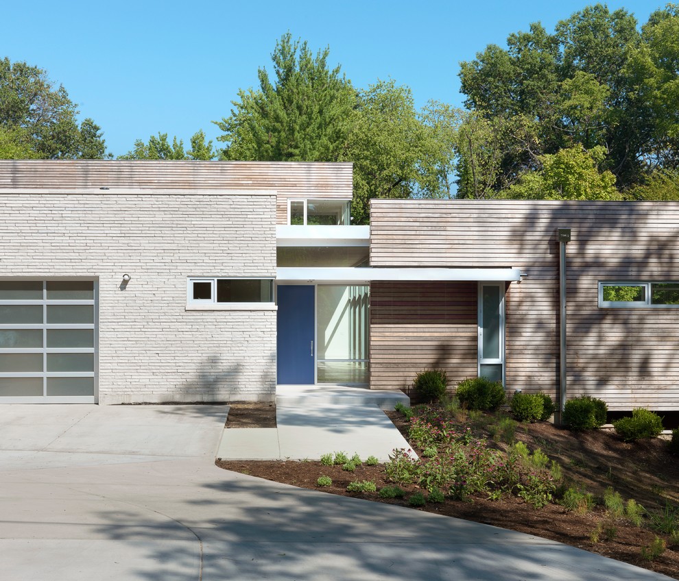Inspiration för moderna hus, med blandad fasad och platt tak