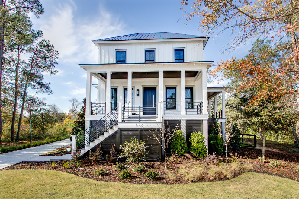 Inspiration for a mid-sized timeless white two-story exterior home remodel in Charleston