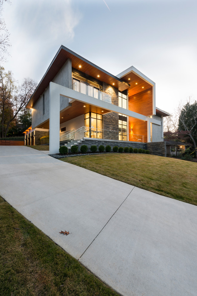 Свежая идея для дизайна: частный загородный дом в стиле модернизм с плоской крышей - отличное фото интерьера