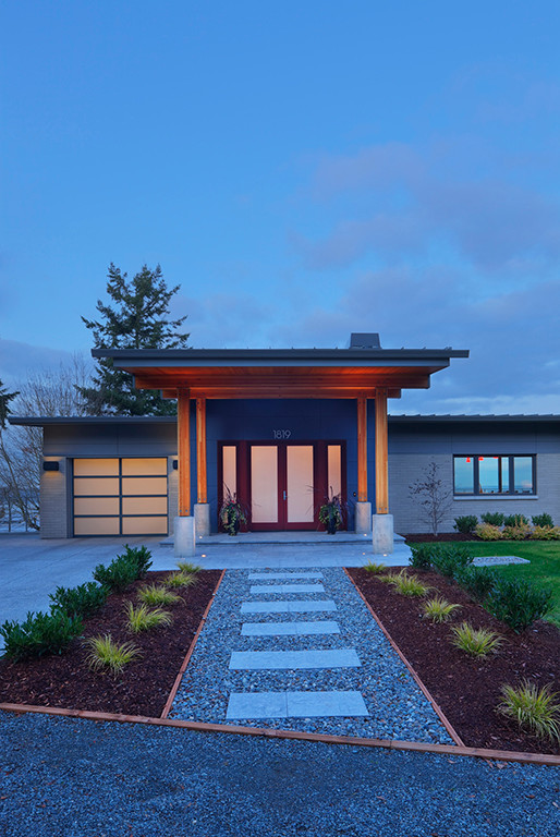 Large minimalist gray one-story mixed siding exterior home photo in Seattle