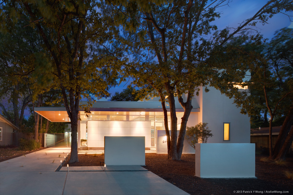 Design ideas for a small and white contemporary two floor render house exterior in Austin.