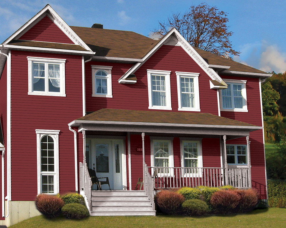 Foto della facciata di una casa rossa classica di medie dimensioni con rivestimento in vinile e abbinamento di colori