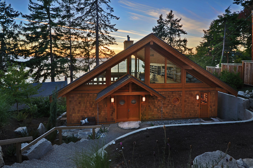 Rustic house exterior in Vancouver with wood cladding and a pitched roof.