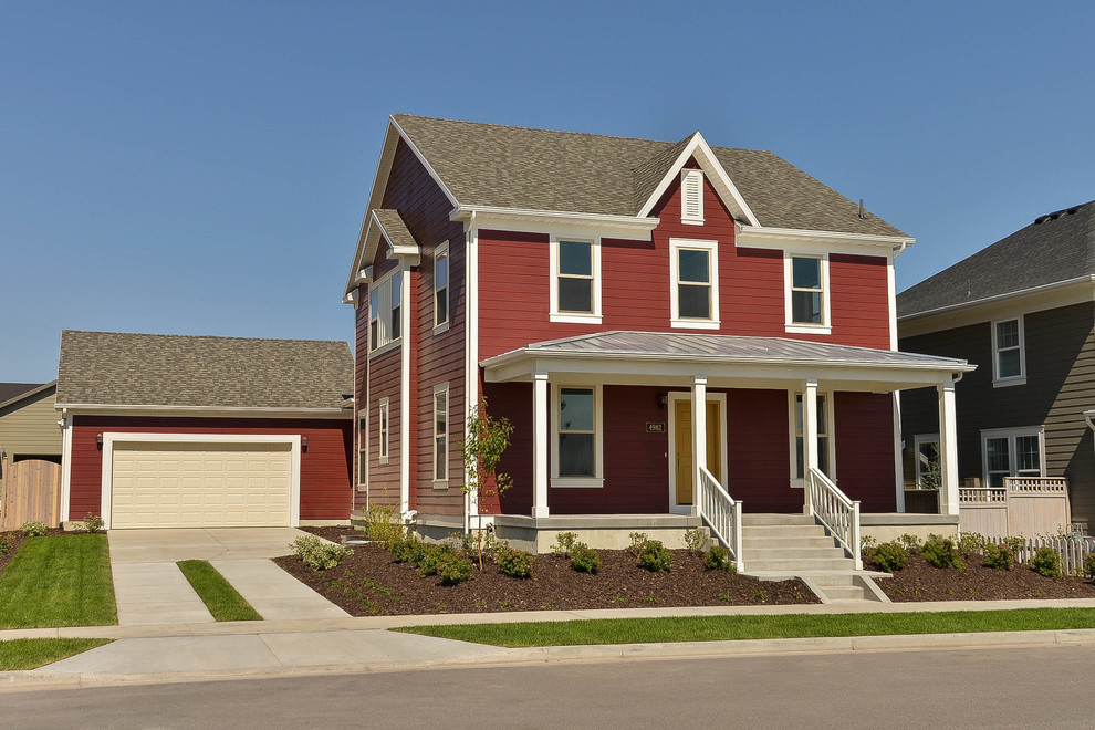 This is an example of a medium sized and red rural two floor house exterior in Salt Lake City.