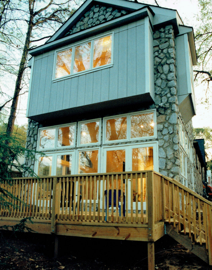 Medium sized and gey rustic two floor house exterior in Atlanta with stone cladding.
