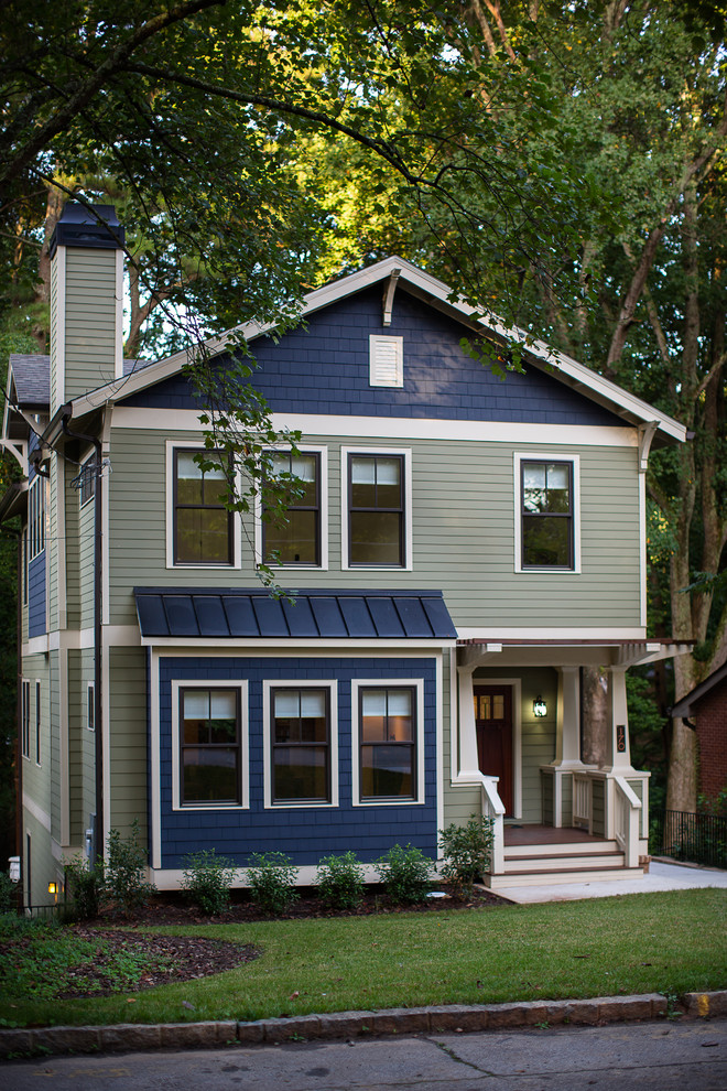 Photo of a medium sized and green traditional house exterior in Atlanta with three floors, concrete fibreboard cladding and a pitched roof.